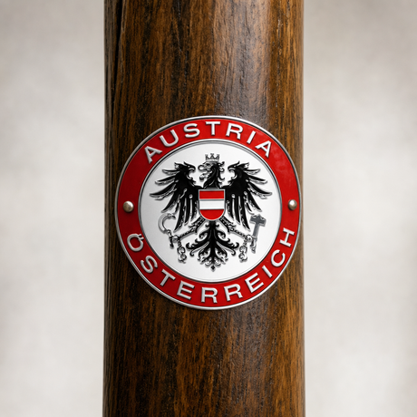 Austria hiking stick medallion installed on a wooden hiking staff
