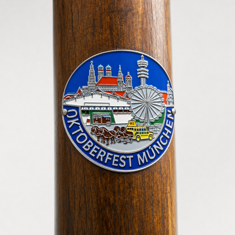 Oktoberfest hiking stick medallion installed on a wooden hiking staff