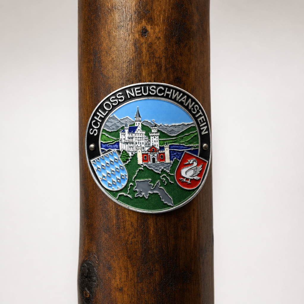 Schloss Neuschwanstein hiking stick medallion installed on a wooden hiking staff