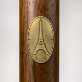 Paris Eiffel Tower hiking stick medallion installed on a wooden hiking staff
