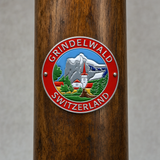 Grindelwald _ Switzerland hiking stick medallion installed on a wooden hiking staff