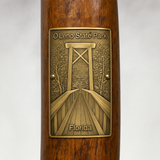 O'leno State Park hiking stick medallion installed on a wooden hiking staff