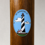 St. Augustine Light hiking stick medallion installed on a wooden hiking staff