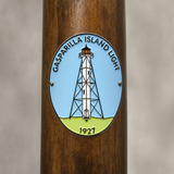 Gasparilla Island Light hiking stick medallion installed on a wooden hiking staff