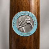 Manatee Springs State Park hiking stick medallion installed on a wooden hiking staff