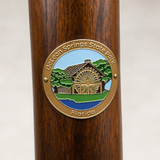 De Leon Springs State Park hiking stick medallion installed on a wooden hiking staff