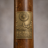 Fort Union National Monument hiking stick medallion installed on a wooden hiking staff
