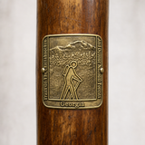 Trails of the Chattachooche State Park hiking stick medallion installed on a wooden hiking staff