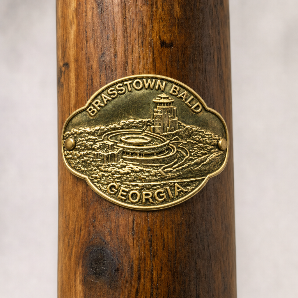 Brasstown Bald State Park hiking stick medallion installed on a wooden hiking staff