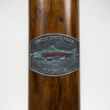 Unicoi State Park Fish hiking stick medallion installed on a wooden hiking staff