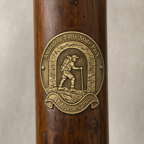 Amicalola Falls State Park - Approach Trail hiking stick medallion installed on a wooden hiking staff