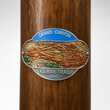 Grand Canyon National Park Kaibab Trail hiking stick medallion installed on a wooden hiking staff