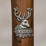 Glacier National Park National Park Deer hiking stick medallion installed on a wooden hiking staff